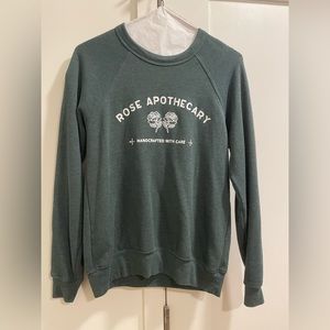 Schitt’s Creek Rose Apothecary Sweatshirt by Bella + Canvas